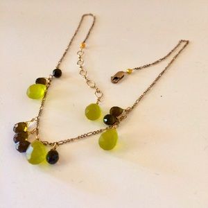 Citrine fine necklace green and ruby red stones.